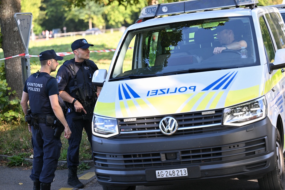 Police officers secure the area where a shooting occurred, in Aarau, northern Switzerland (AFP/Getty)
