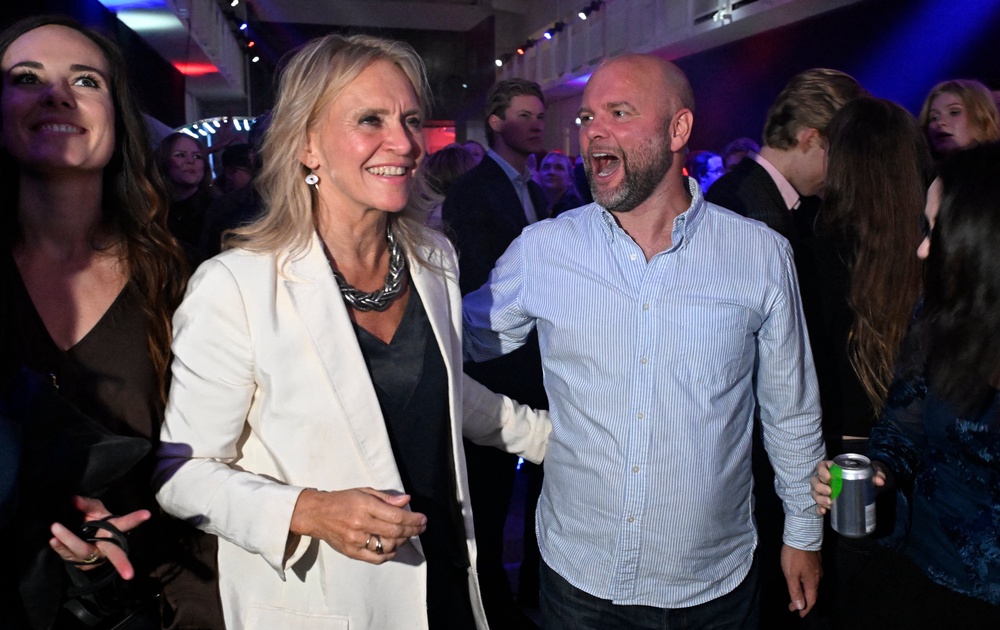 Iceland's Foreign Minister Thorgerdur Katrin Gunnarsdottir (L) reacts alongside a supporter as early results are announced during the 'Yes' campaign's referendum night event in Reykjavik, Iceland, on August 30, 2026 (AFP/Getty)
