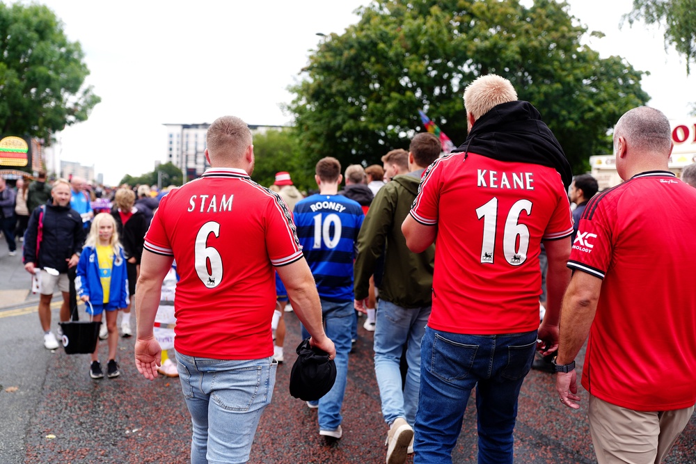Manchester United fans arrive ahead of the Ipswich Town game (PA)