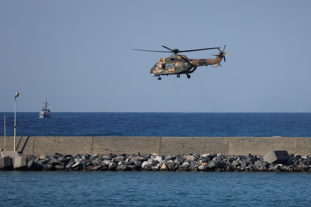 A helicopter flies near the area where a passenger boat capsized off the coast of Kyrenia in Turkish-controlled northern Cyprus, August 30, 2026. (Reuters)