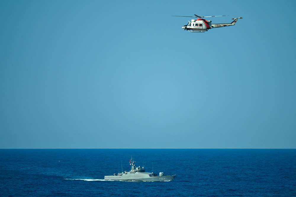Turkish naval ship P-1214, a Tuzla-class patrol boat, and a helicopter search the waters during a rescue operation off the coast of Kyrenia, in the self-proclaimed Turkish Republic of Northern Cyprus (TRNC), recognised only by Turkey, on August 30, 2026, after a ferry capsized. (AFP/Getty)