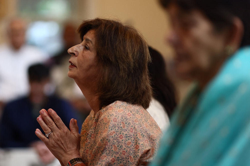 A member of the Nepali community attends special prayers at the South London Sanatan Mandir, as 16 people from the community centre remain missing following deadly flash floods and mudslides in Nepal, in Coulsdon, Britain, August 30, 2026. (Reuters)
