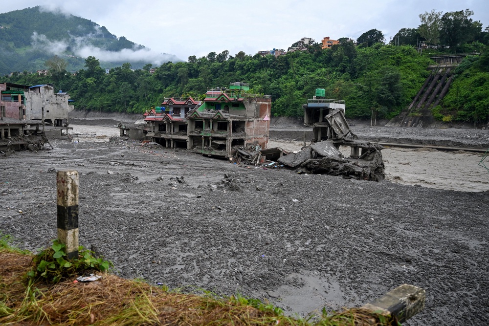 Damaged houses lie deluged in sludge after flash floods at Trishuli Center in Nepal's Nuwakot district on August 31, 2026. Nepal was buried on 31 August, with hundreds of bodies retrieved after a deadly, tsunami-like flood crashed through the Himalayan region, sweeping away villages and leaving thousands still missing. Distraught families have packed rescue stations and hospitals in search of their missing relatives, while others have faced the grim task of identifying bodies at overflowing morgues (AFP/Getty)