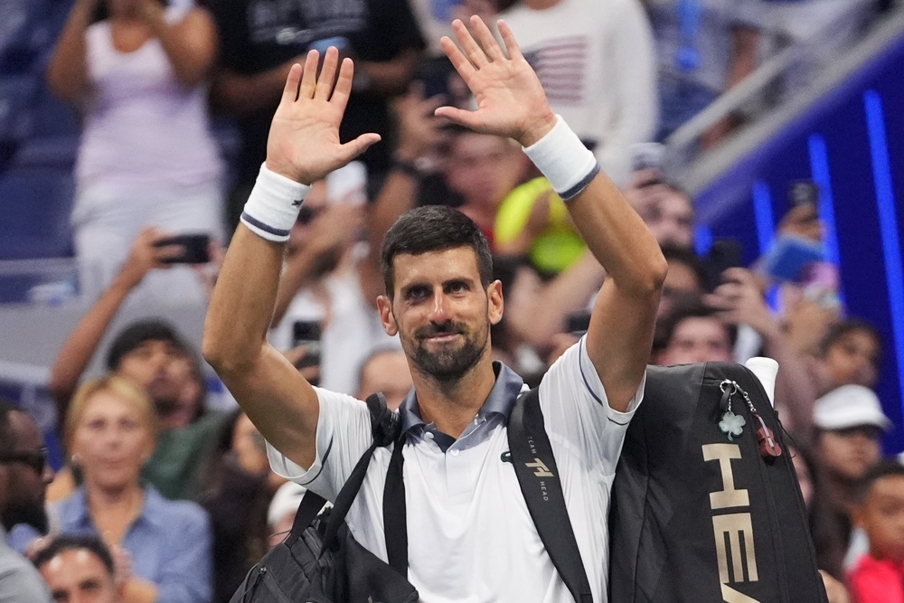 Novak Djokovic waves goodbye after his first-round exit (AP)