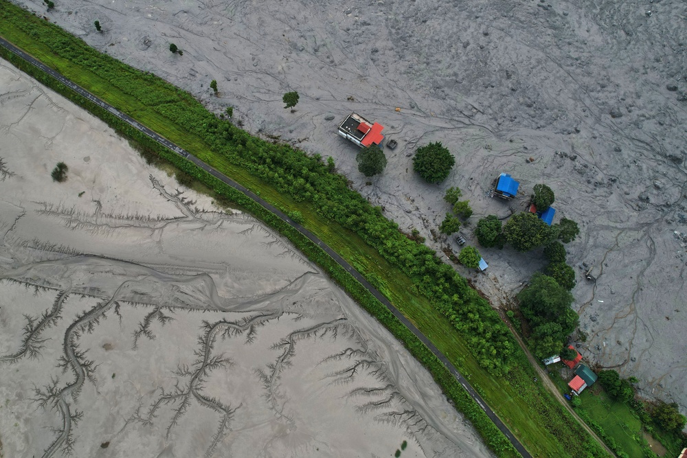 A drone view shows a major section of Pasang Lhamu highway washed away along swollen Trishuli river by recent flash floods cutting off Rasuwa district from Nuwakot area, Nepal, Monday, 31 August 2026 (AP)