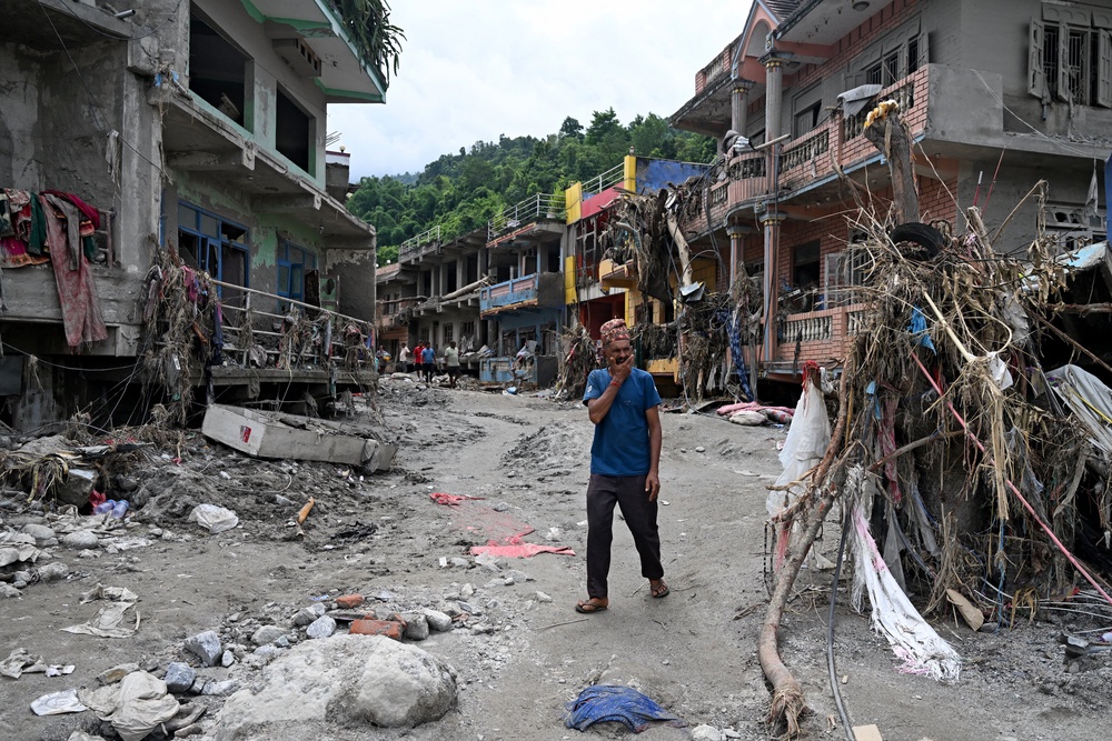 A man surveys the devastation caused by the flooding in Devighat in Nepal’s Nuwakot district (AFP/Getty)