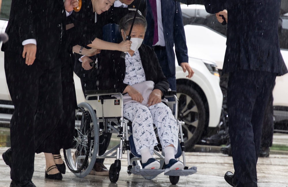 Unification Church leader Hak Ja Han, on the wheelchair, arrives for the sentencing hearing on allegations of bribery and political funding, at the Seoul Central District Court in Seoul, South Korea (AP)
