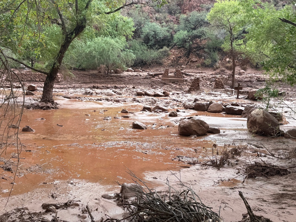 A flooded Bright Angel Creek is seen near the historic Phantom Ranch Lodge in Arizona’s Grand Canyon on Saturday afternoon. The rain fell incredibly fast (National Park Service via AP)