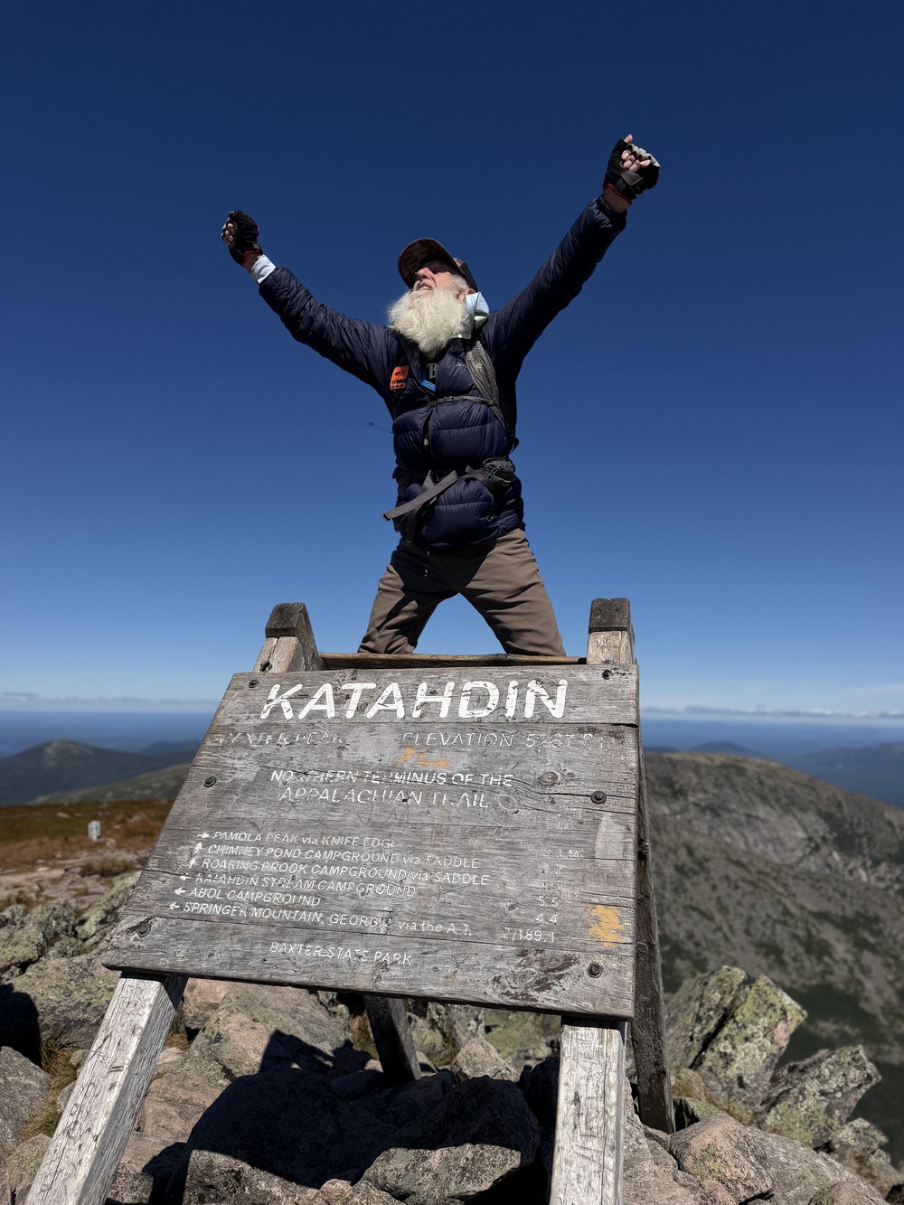 Sanders celebrates after completing his hike (AP)