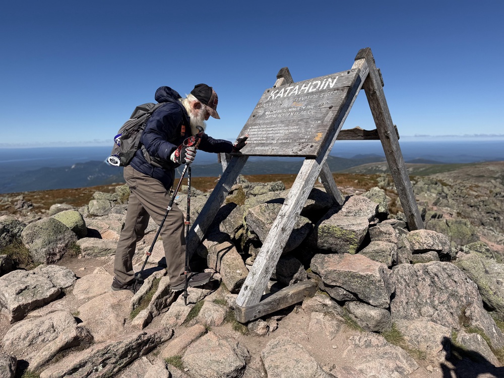 Sanders pauses for a prayer upon completing his hike of the Appalachian Trail (AP)