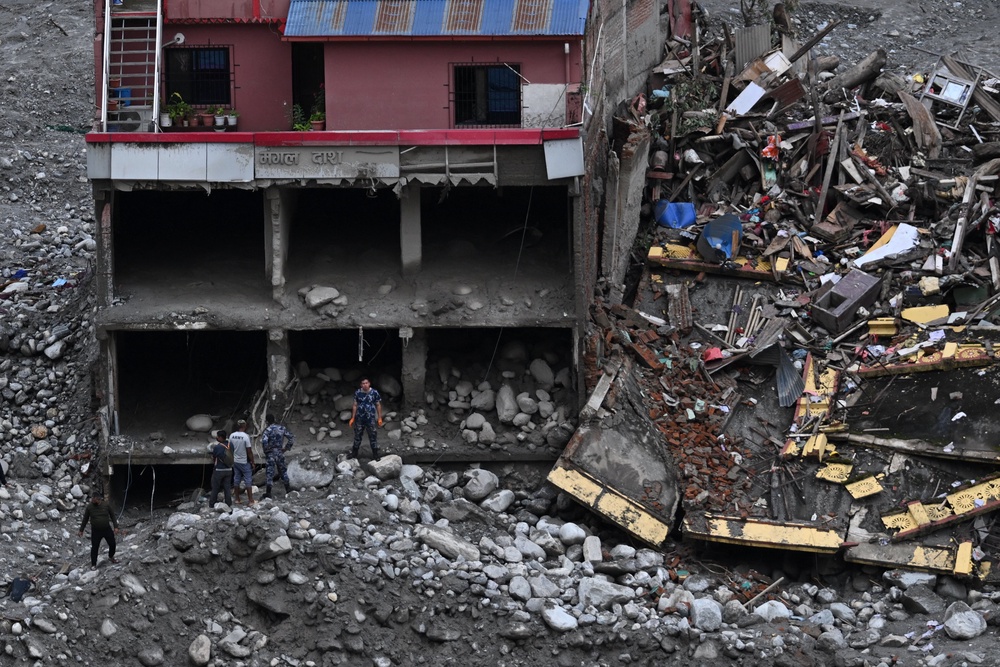 Nepal's army personal take part in search operations in the aftermath of flash floods in Nepal's Nuwakot district (AFP/Getty)