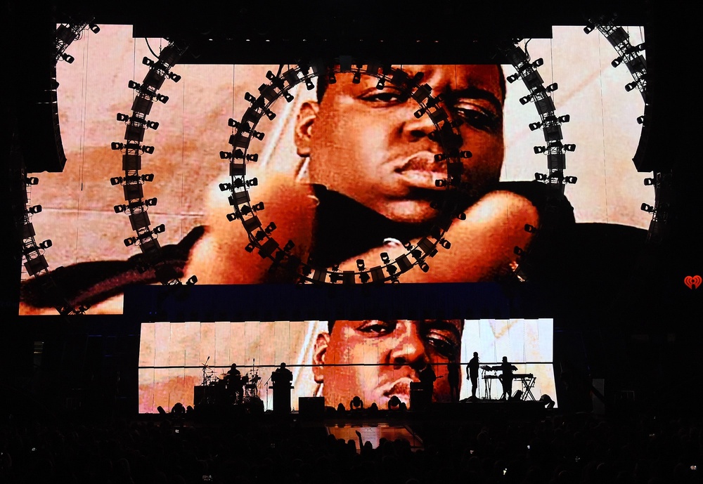 Images of the late rapper The Notorious B.I.G. are shown during a performance by recording artist Sean 