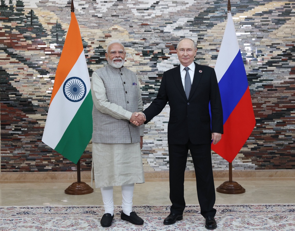Narendra Modi and Vladimir Putin pose for a photo during their meeting on the sidelines of the SCO summit (AP)