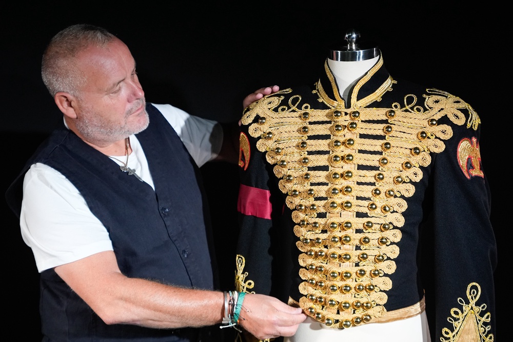 Propstore's music specialist Mark Hochman looks at Michael Jackson´s black-and-gold military-style jacket (PA)