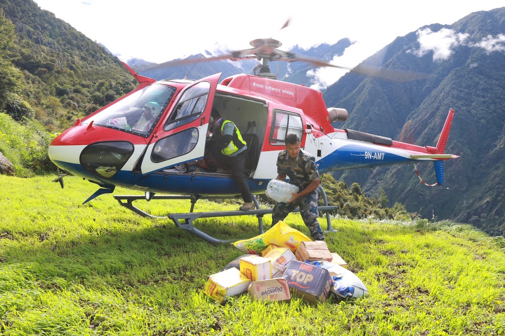 A Nepal Armed Police Force personnel unloads relief supplies (AFP/Getty)