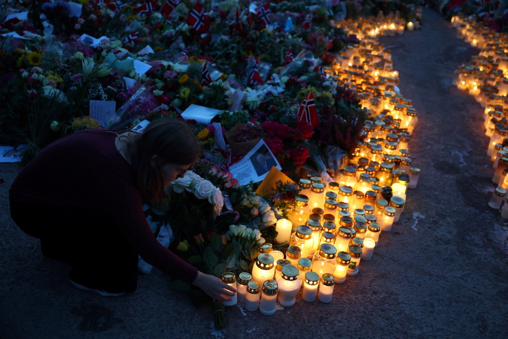 Tens of thousands of people gathered outside the royal palace in Oslo on Saturday to pay tribute to King Harald (Reuters)