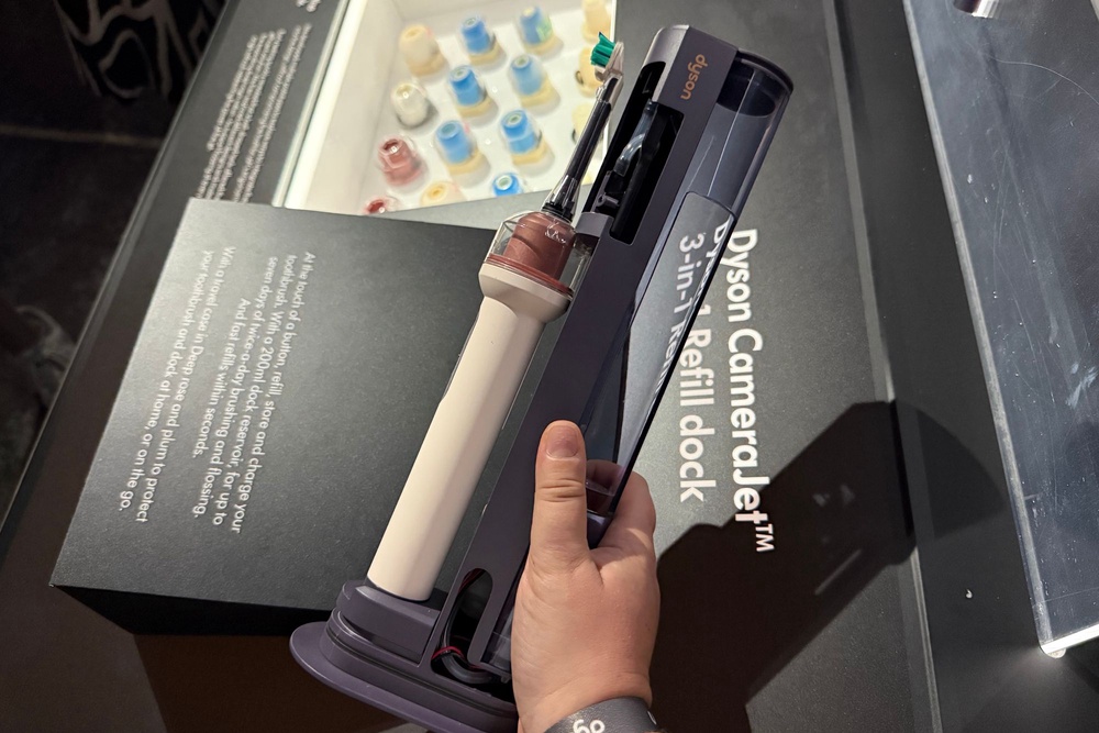 The charging dock has the ability to fill up your brush's on-handle mouthwash tank at the touch of a button (Lucy Smith/The Independent)