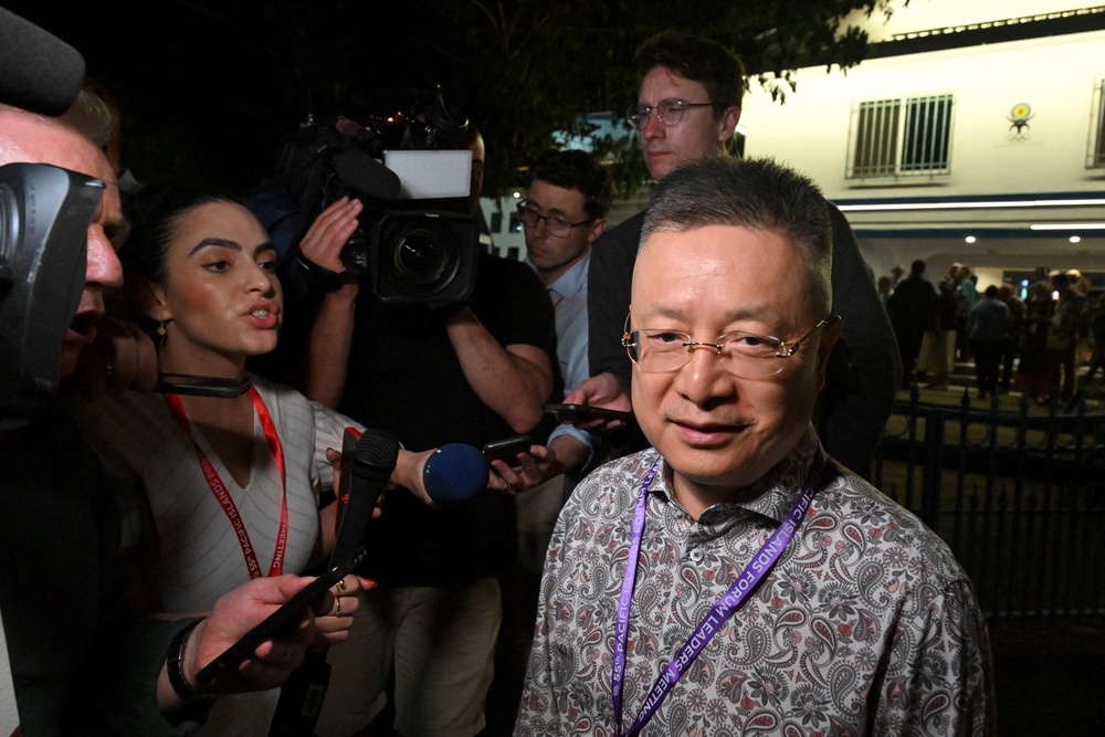 China's special envoy for Pacific Island Countries Affairs Qian Bo leaves the opening ceremony during the 55th Pacific Islands Forum Leaders Meeting in Koror (Reuters)