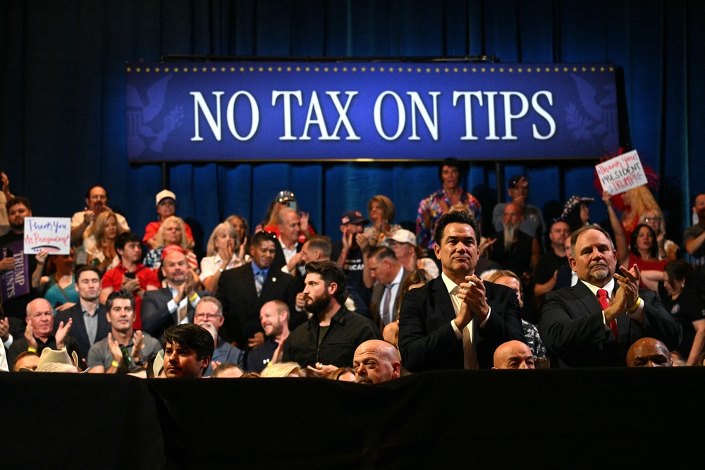 Cain is also an ardent Trump supporter and attended an event in August to promote the president’s ‘No Tax on Tips’ policy (AFP/Getty)
