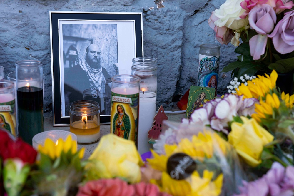 A memorial outside the Venture-N Bar in Tucson for Cameron Capara and Vincent Siquieros, who were fatally shot in the parking lot shortly after midnight Monday (AP)