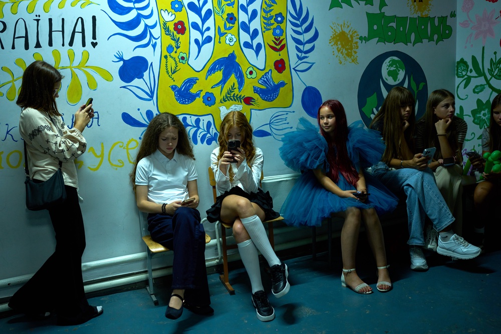 Young girls sit in an underground shelter during an air raid alarm during the traditional back to school celebrations in Kyiv, Tuesday, Sept. 1, 2026. (AP Photo/Francisco Seco) (Copyright 2026 The Associated Press. All rights reserved)