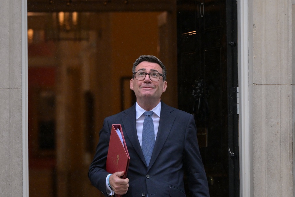 Andy Burnham leaves 10 Downing Street to attend PMQs (AP)