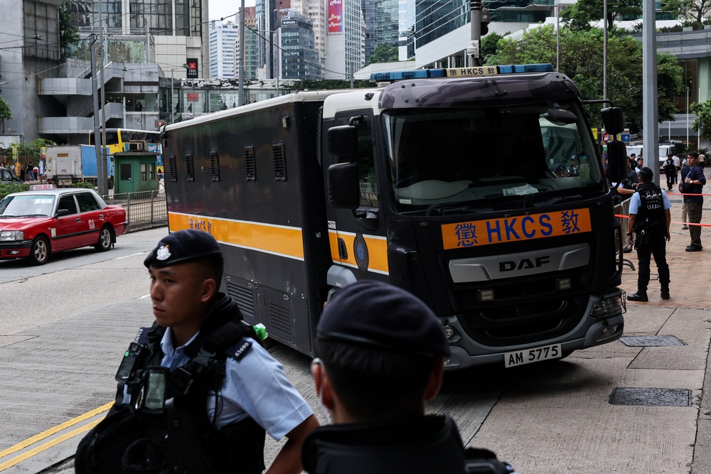 A prison van, believed to be carrying jailed pro-democracy activist Joshua Wong, arrives at the High Court for a national security plea and sentencing hearing, in Hong Kong (Reuters)