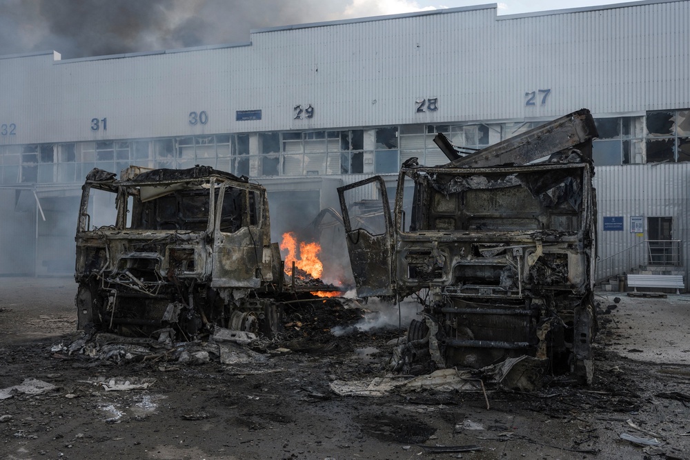burnt-out trucks near a damaged auto parts warehouse following an air attack in Kyiv (AFP/Getty)