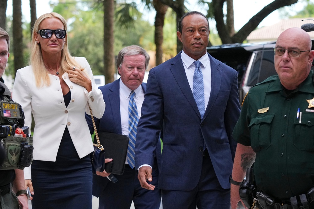 Tiger Woods arrives for his hearing accompanied by Vanessa Trump (Lynne Sladky/AP). (AP)