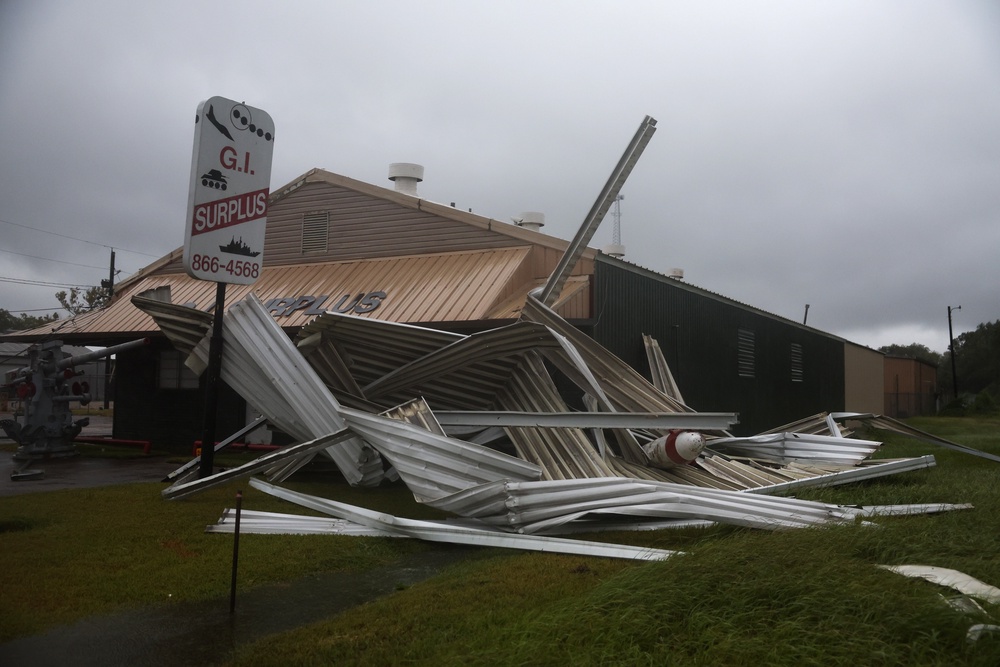 A damaged G.I. Surplus store is seen during Tropical Storm Edouard on Tuesday in Beaumont, Texas. Edouard is the fifth named storm of the Atlantic hurricane season (Getty)
