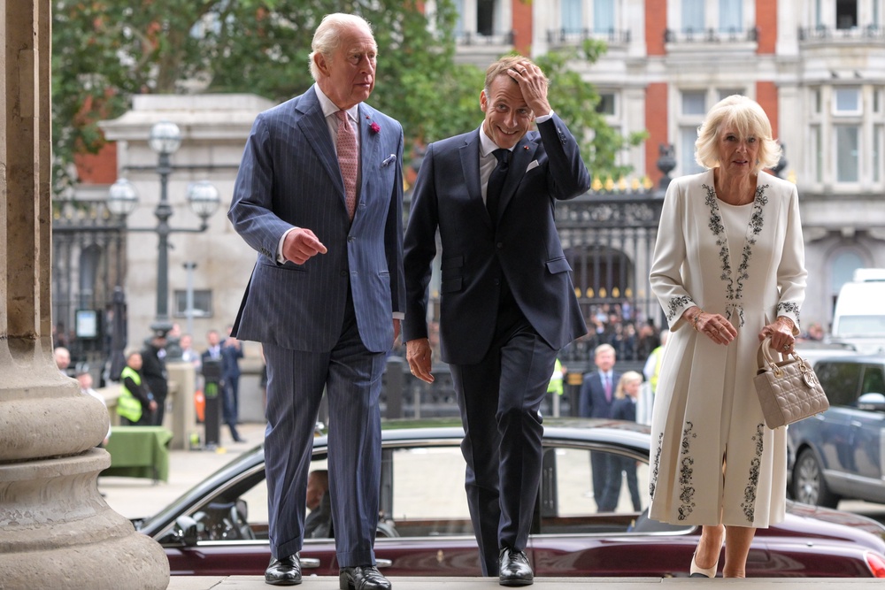 Britain’s King Charles III, Emmanuel Macron, president of France, and Queen Camilla arrive to view the Bayeux Tapestry (AP)