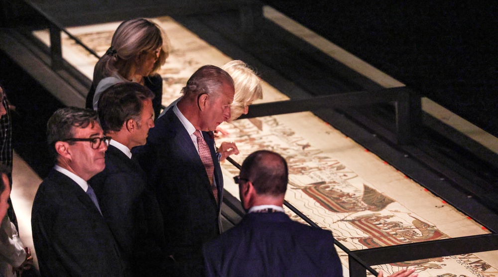 The King, the PM and their guests from France looking at the Bayeux Tapestry (Richard Pohle/The Times/PA) (PA Wire)