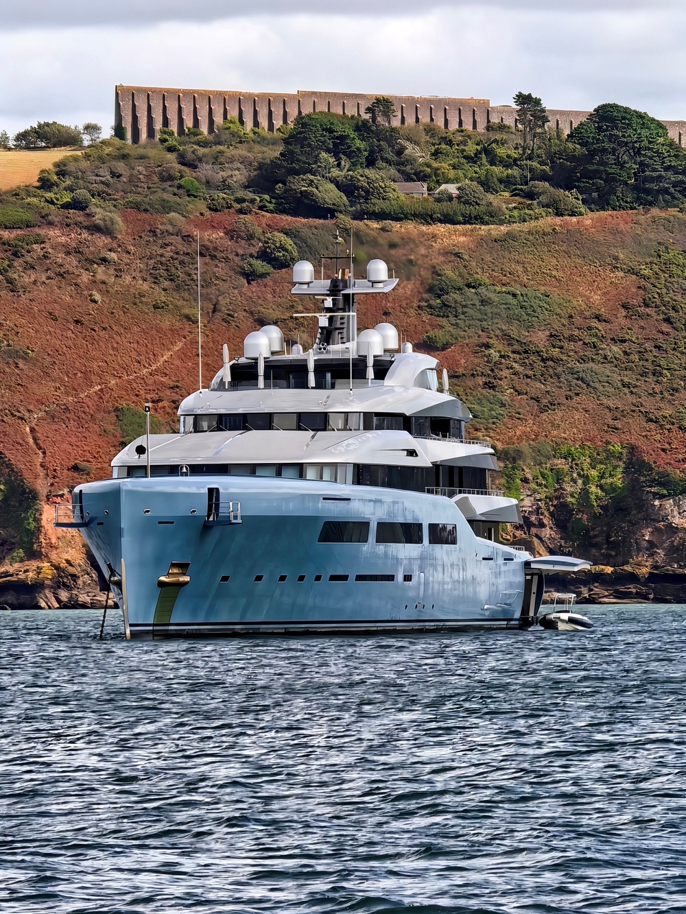 Locals say the yacht has been taking cover behind the Plymouth breakwater since arriving during the summer holidays and has been there all across the Bank Holiday weekend (James Dadzitis / SWNS)