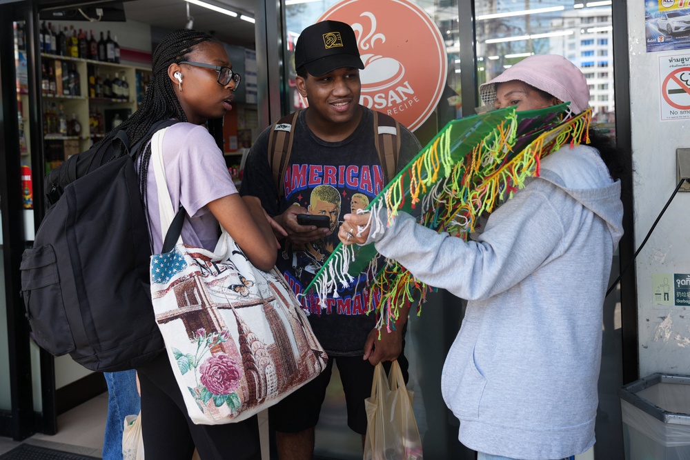 Crew members of the USS Abraham Lincoln talk to a souvenir vendor in Pattaya, Thailand, Thursday, Sept. 3, 2026. (AP Photo/Sakchai Lalit) (Copyright 2026 The Associated Press. All rights reserved.)