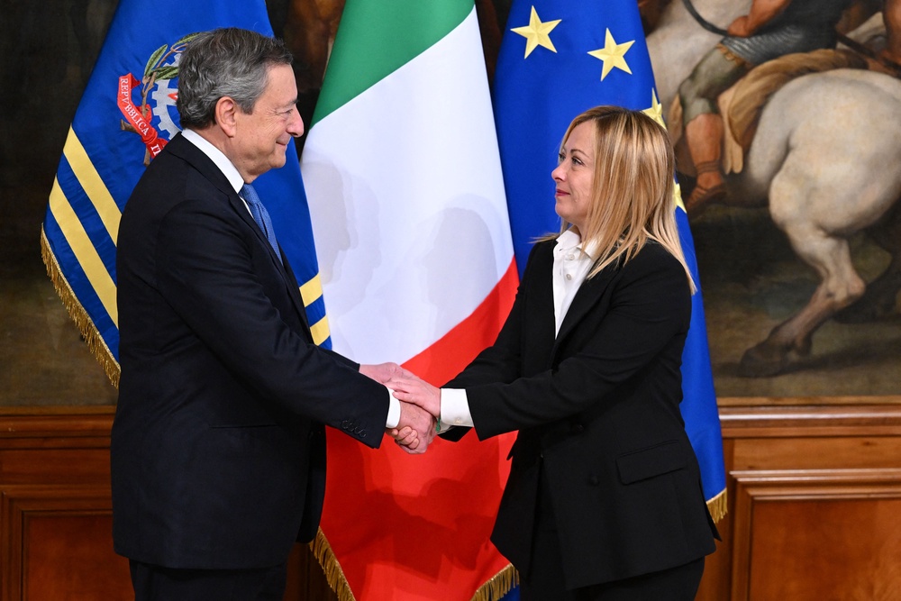 Italy's outgoing prime minister, Mario Draghi and Italy's new prime minister, Giorgia Meloni shake hands during the cabinet minister bell handover ceremony at Palazzo Chigi in Rome on October 23, 2022 (AFP/Getty)