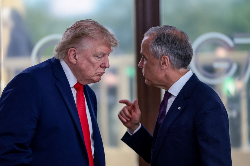 Mark Carney and Donald Trump at the G7. The Canadian PM has imposed ‘dollar for dollar’ retaliatory tariffs after the U.S. president launched new levies against his northern neighbor (Reuters)