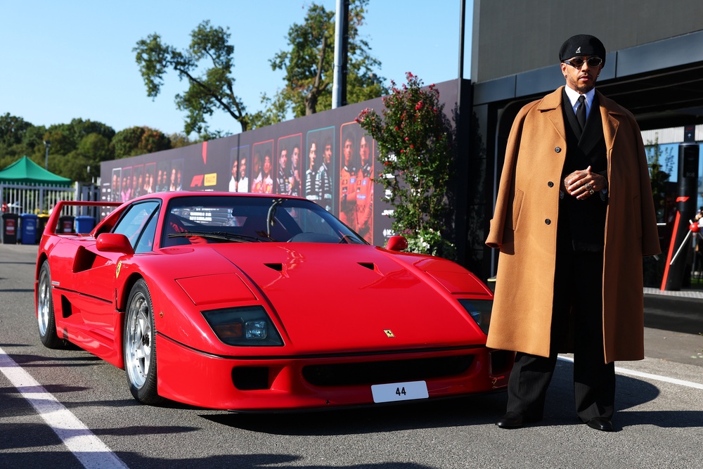 Hamilton poses next to his F40 car outside the Monza paddock (Getty)