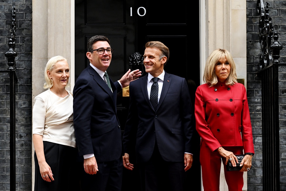 The Macrons were greeted by Prime Minister Andy Burnham and his wife Marie-France Van-Heel (Leon Neal/PA) (PA Wire)