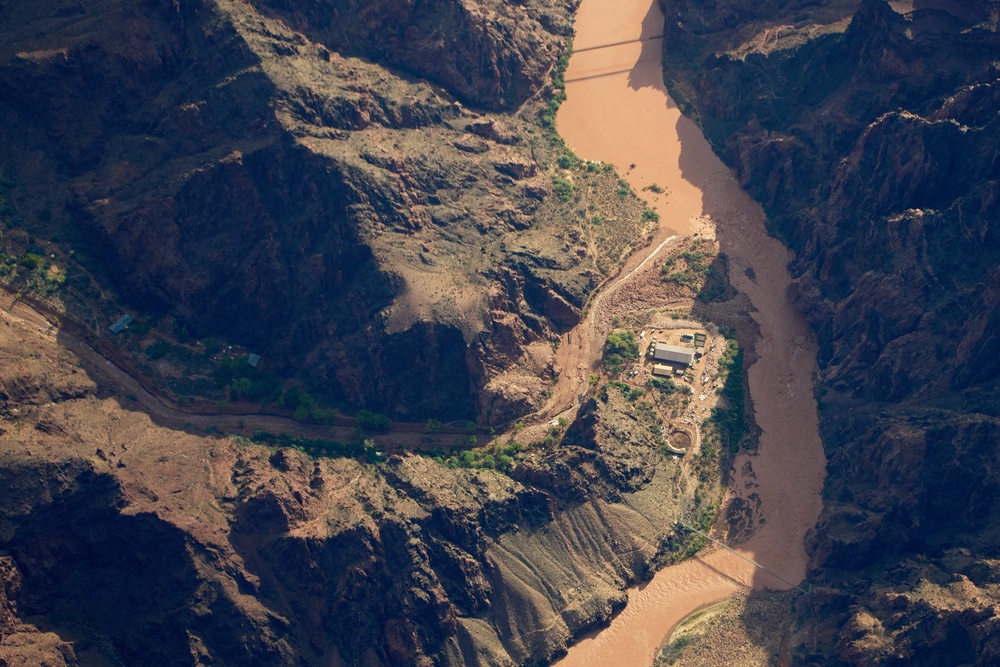 Bright Angel Canyon, damaged by flash floods, runs into the Colorado River in the Grand Canyon, Monday, Aug. 31, 2026 (AP Photo/John Locher)