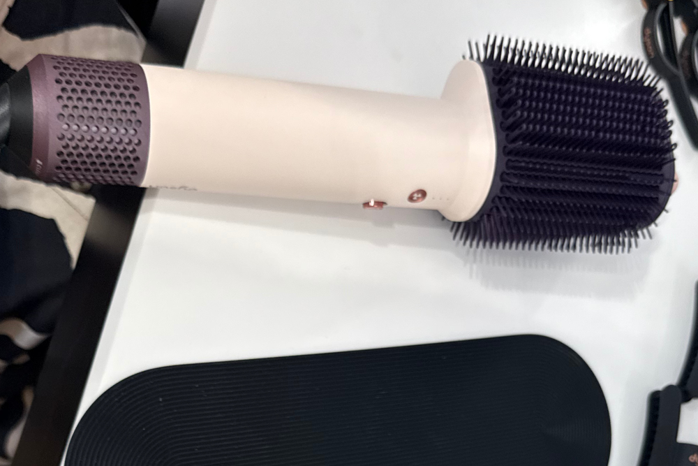Compared with the airwrap, the brush head on the airsmooth is a permanent fixture (Lucy Smith/The Independent)