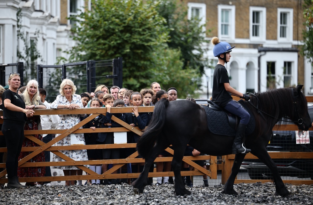 Camilla watches a riding demonstration (Henry Nicholls/PA) (PA Wire)