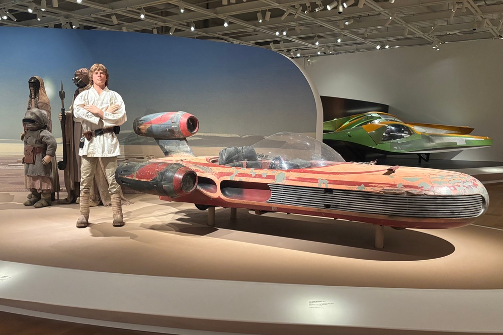 Luke Skywalker's Landspeeder is one of the Star Wars vehicles on display at George Lucas' new museum in Los Angeles (Kevin E G Perry/The Independent)