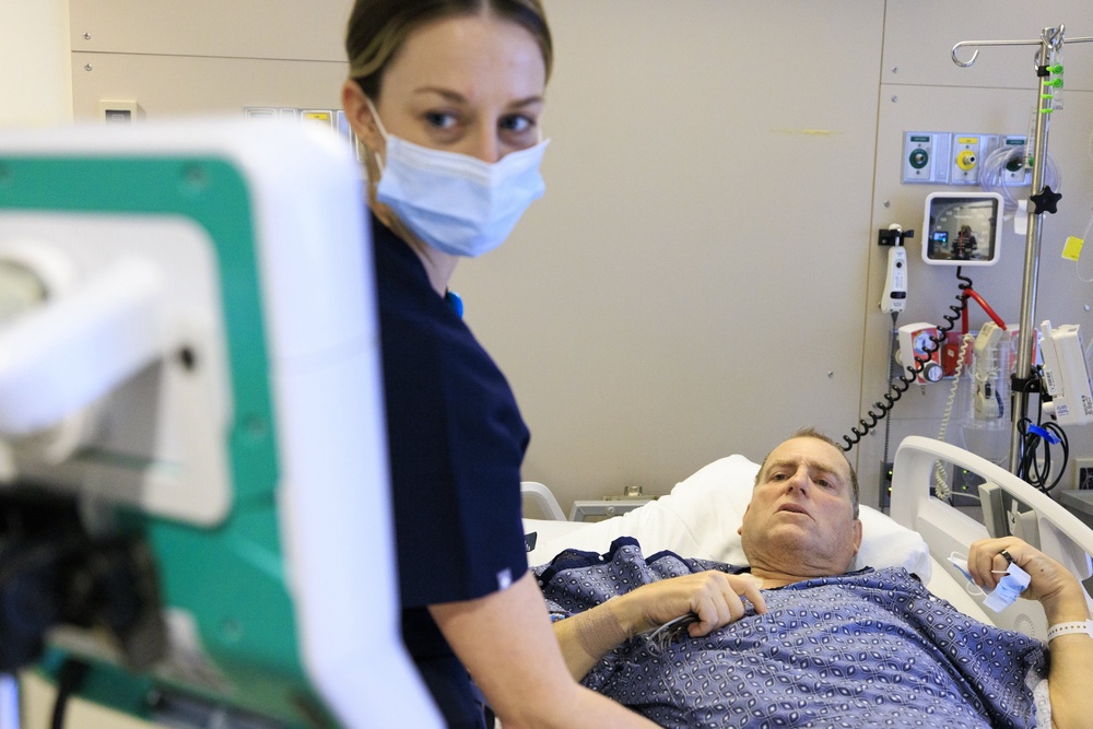 Nurse Melanie Brodner monitors Mr Andrews four days after his surgery (Kate Flock/Massachusetts General Hospital/PA) (PA Media)