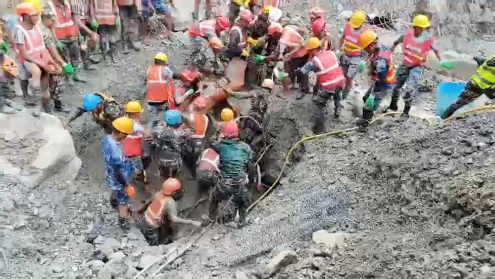 Rescuers carry a survivor from a tunnel linked to a hydropower station following deadly flash floods and mudslides, at a location given as Rasuwa district, Nepal (Reuters)