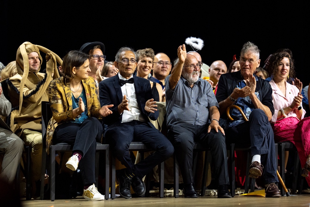 Nobel Prize winners Esther Duflo, left, Abhijit Banerjee, Michel Mayor, and Tim Hunt are presented on stage during the Ig Nobel Prize ceremony in Zurich (AP)