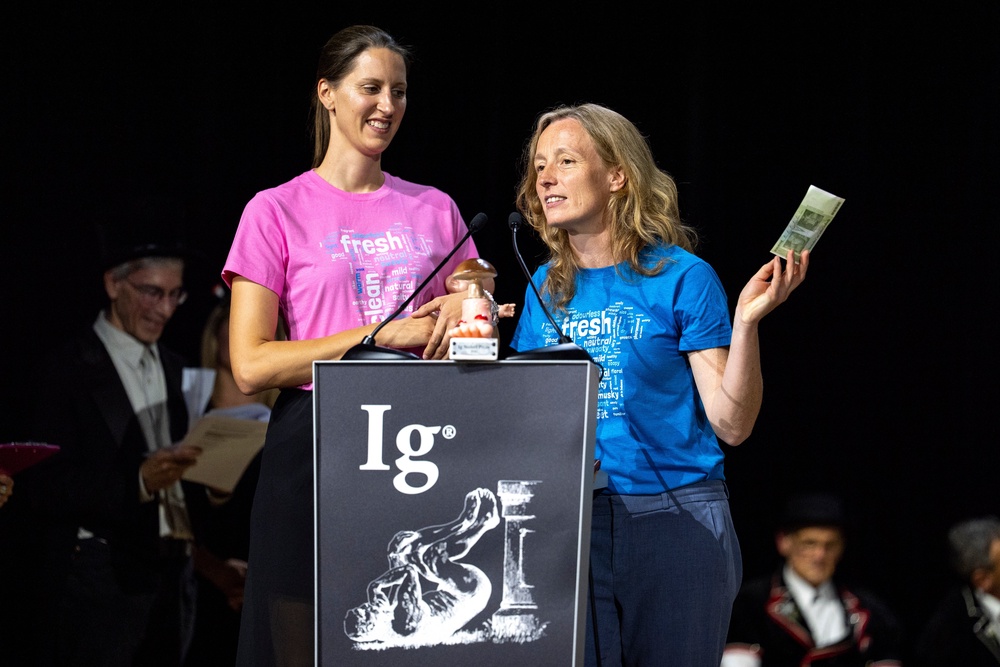 Ig Nobel Prize winners Agnieszka Sorokowska, left, and Ilona Croy speak during the awards ceremony in Zurich (AP)