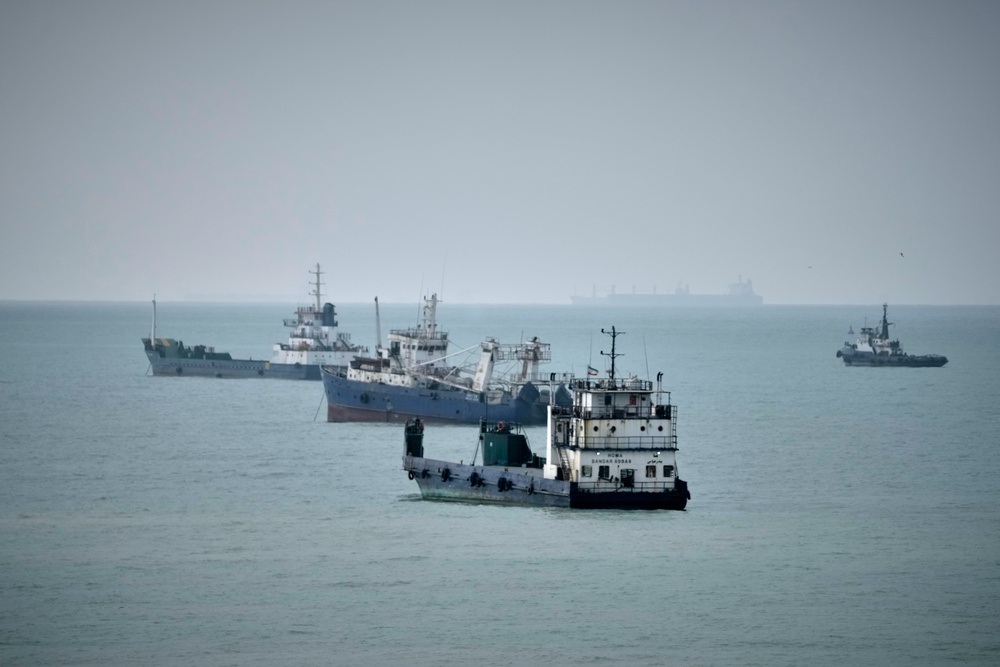 Commercial vessels lie anchored in the Strait of Hormuz off Bandar Abbas, Iran (AP)