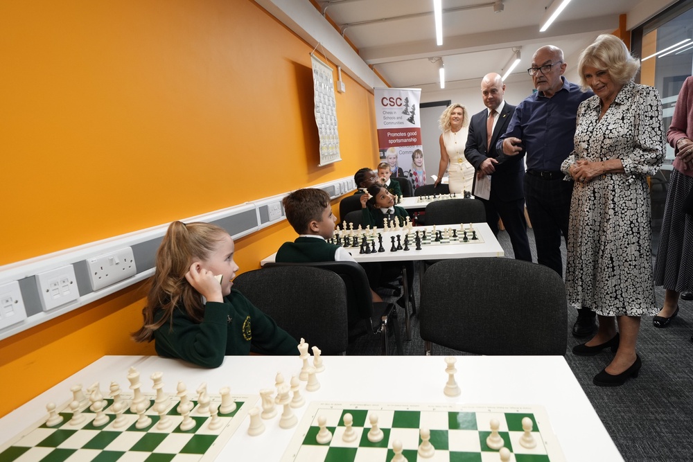 Camilla watches local schoolchildren play chess during a visit to Liverpool (Peter Byrne/PA) (PA Wire)