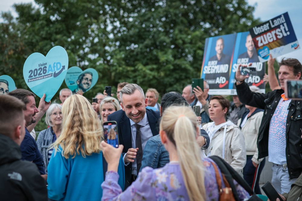 Ulrich Siegmund greets supporters as he arrives for a debate on MDR regional TV in Magdeburg, eastern Germany on August 26 (AFP/Getty)