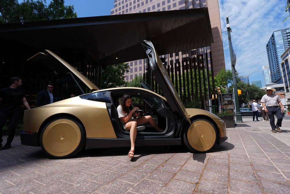 The National Highway Traffic Safety Administration said it was looking into whether Tesla was in full compliance with federal rules in deploying so-called Cybercabs in Austin, Texas, given that the two-seater cars lack steering wheels, mirrors or brake pedals typically required of all vehicles (AP)